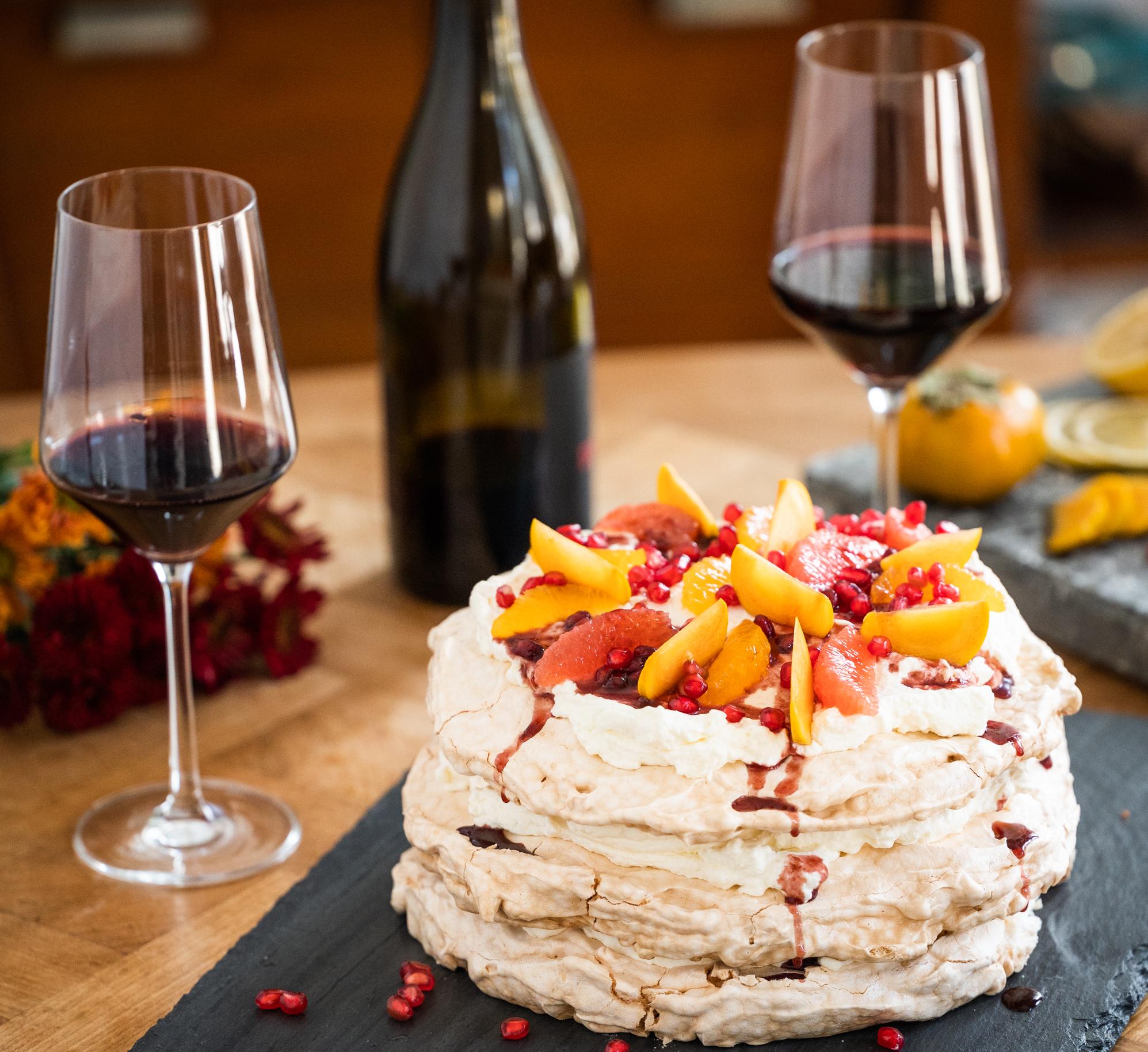 Pavlova with Red Wine Winter Fruit Compote & Whipped Cream
