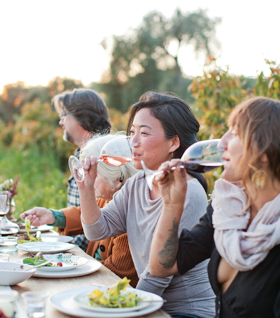 women sipping wine outdoors