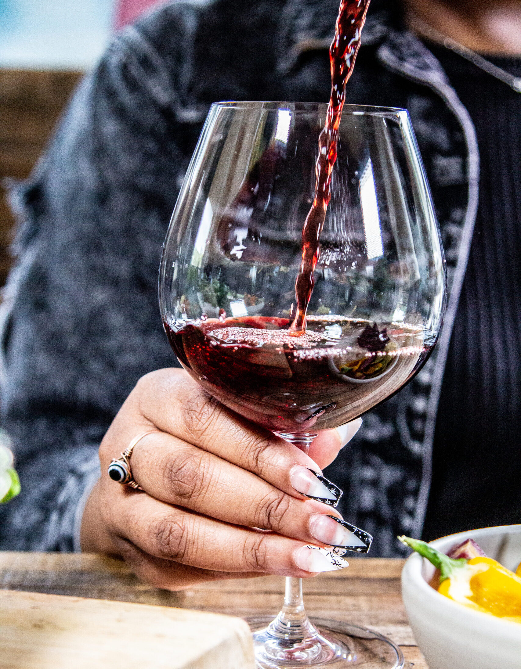 red wine being poured into glass